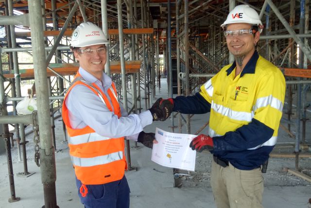 Nathan Merens receives John Holland